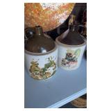 2 1 gallon stoneware jugs, handle jugs with some