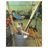 Shovels, squeegees, rakes + weed puller in barrel