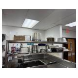 Contents on two shelves in corner of  kitchen