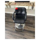 Black salon chair with metal base