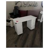 White desk approximately 3-4 feet wide