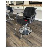 Black salon chair with metal base