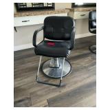 Black salon chair with metal base
