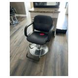 Black salon chair with metal base