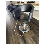 Salon chair, black metal base rounded back