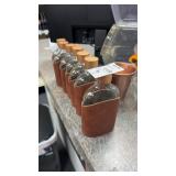 (7) Glass and leather flasks