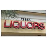 Retail liquor sign approximately 8 feet long. See