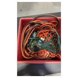 Milk crate of assorted power cords