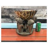 Carved wood bowl on clay holder