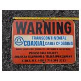 Transcontinental Coax Warning Sign