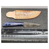 Damascus knife with leather sheath