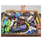 Flat full of Hot Wheels and other toy cars