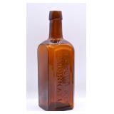 Antique F.E. Suire Amber Glass Medicine Bottle