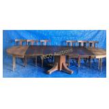 Antique wooden table w/6 chairs & 8 leafs