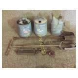 Vintage kerosene cans and yard tools,