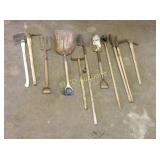 Lot of yard tools, shovels, pic axes, post hole