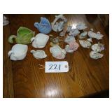 Assorted ceramic swan figurines and planters
