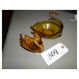 Two amber art glass swans