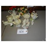Assorted swan figures, planters, snowbabies