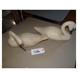 Two wooden swan carvings