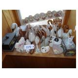 Shelf of assorted wooden swan figures, boxes, dï¿½co