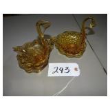 Two amber art glass swan dishes