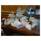 Assorted ceramic swan dishes and figurines