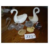 Assorted plastic swans and swan candles