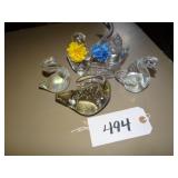 Four solid glass swan figures