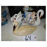 Three ceramic swan figurines