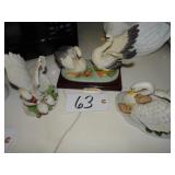 Three ceramic swan figurines