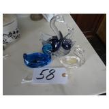 Three solid glass swan figurines