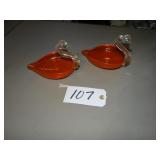 Two matching orange art glass swan dishes
