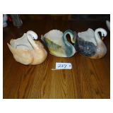 Three large ceramic swan planters