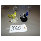 Four Solid art glass swan dishes