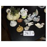 Assorted swan dishes and planters