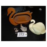 Plastic and wooden swan figures