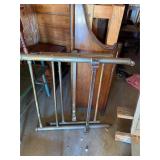 Two parts to an antique metal bedframe, head, and
