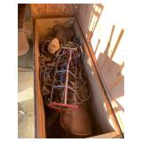 Large wooden crate with horse, saddles, and other