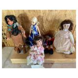 Lot of 4 collectible dolls, and snowman