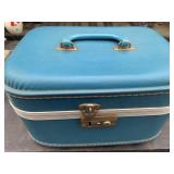Small vintage blue luggage