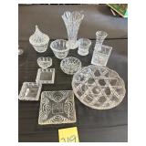 Collection includes various pieces of clear pat..
