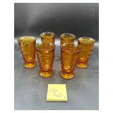 Set of vintage amber glass goblets are in the W..