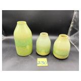 Green ceramic vases featuring a textured geomet..