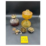 Vintage glass oil lamps & parts including an am..