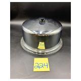Vintage chrome cake stand featuring a domed lid..