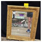 Gold framed mirror  23 x27