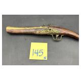 Flintlock pistol, likely a 19th-century Indo-Pe..
