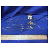 4 necklaces.  Two are Bolo style (one pair of