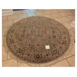 58 in round ornate neutral/red area rug